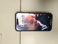 CS1404/2025 IPHONE WITH WHITE AND BLUE COVER